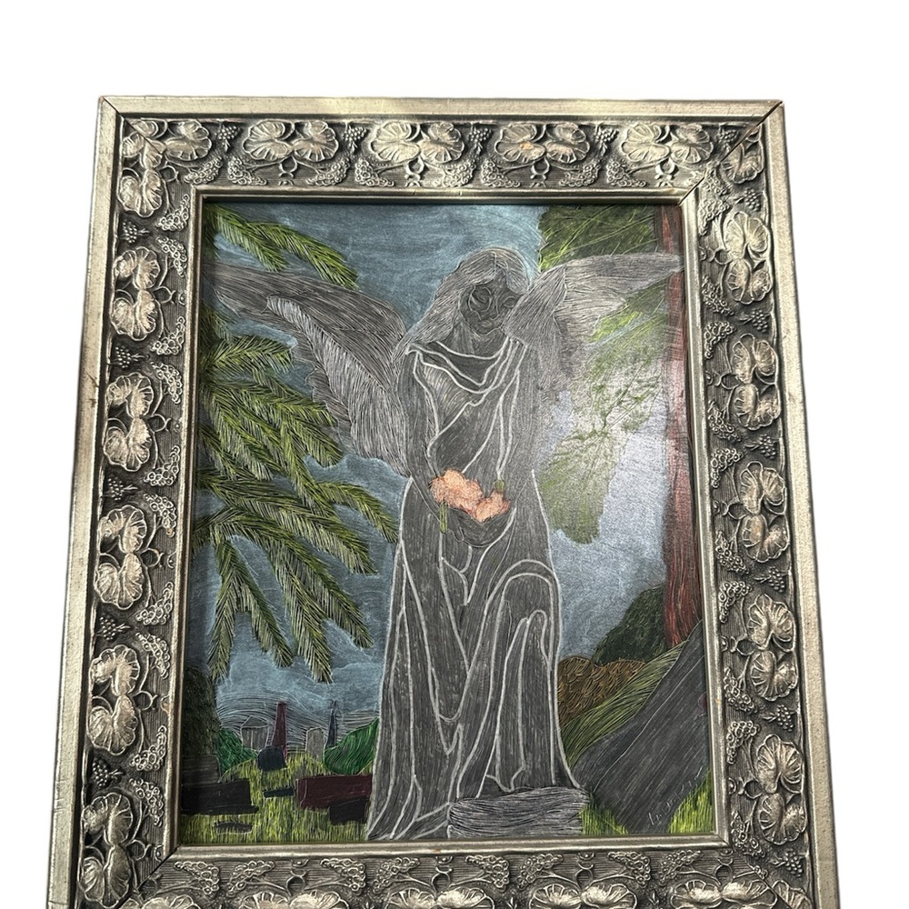 Angel in the cemetery with a wooden frame